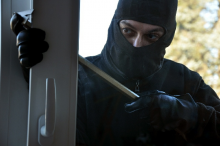 Man breaking into house